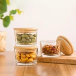 ظرف شیشه‌ای گرد لیمون 190 میلی درب چوبی کد 219459
